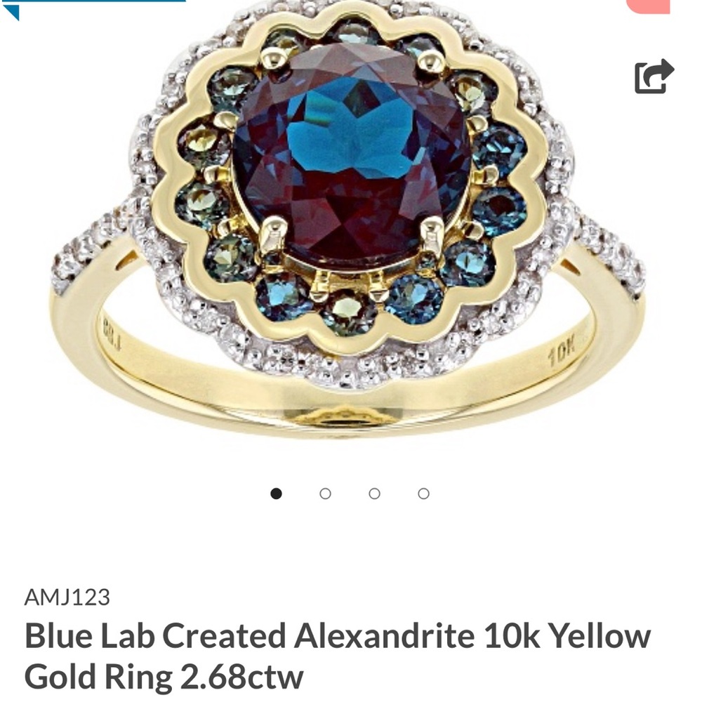Alexandrite 2.57 carat lab created alexandrite. -.11 carat diamond in 10k gold